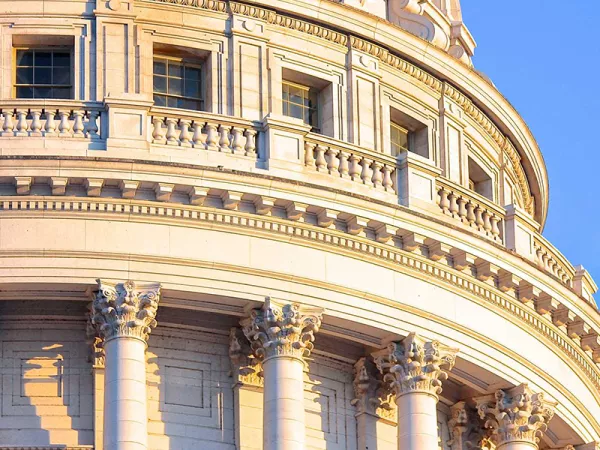 A zoomed picture of the Wisconsin State Capitol building's dome in the sunlight.