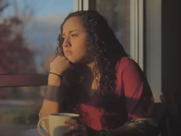 Girl looking out window