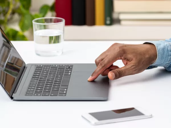 Hand on computer