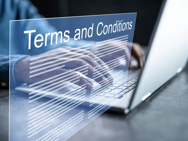 Terms and conditions wording overlaying laptop