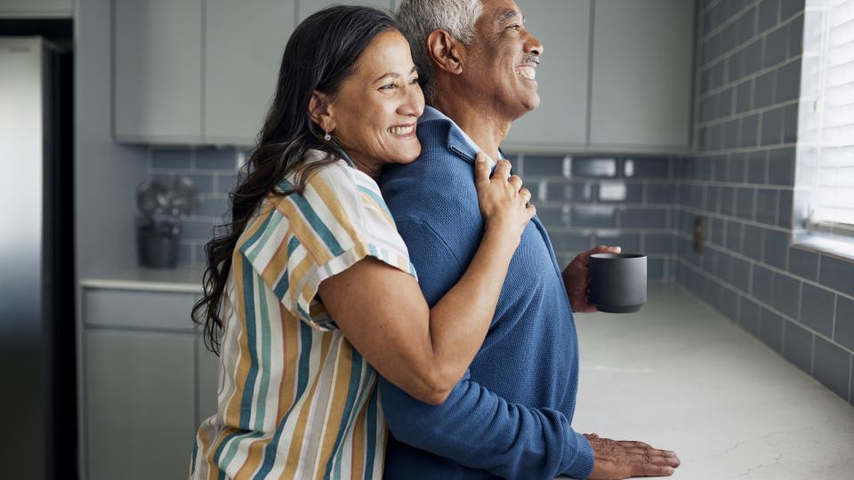 retiree couple embracing