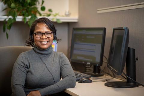 Call center employee smiling at the camera